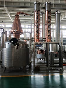 New 2000L still with 2 columns and 20 plates, equipped with gin baskets for small-batch craft distillation. Ideal for producing premium spirits in a commercial distillery setting - Distillery Equipment Brisbane