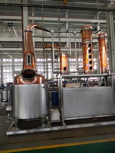 New 750 Liter still with 1 column, 4 plates, gin basket for small-batch craft distillation and production processes in the beverage or chemical industry. The still features various components such as the boiler, columns, condenser - Distillery Equipment Brisbane